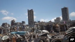 Damaged cars remain at the site of the Aug. 4 deadly blast in the port of Beirut that killed scores and wounded thousands, in Beirut, Lebanon, Aug. 17, 2020. 