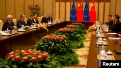 Chinese President Xi Jinping, meets with European Commission President Jean-Claude Juncker and European Council President Donald Tusk, during a meeting at the Diaoyutai State Guesthouse in Beijing, July 16, 2018. 