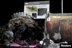 Remains of Iranian "Qiam" ballistic missile provided by the Pentagon are on display before U.S. Ambassador to the United Nations Nikki Haley briefs the media on highlights of the U.N.'s 2231 Implementation Report at Joint Base Anacostia-Bolling in Washington, Dec. 14, 2017.