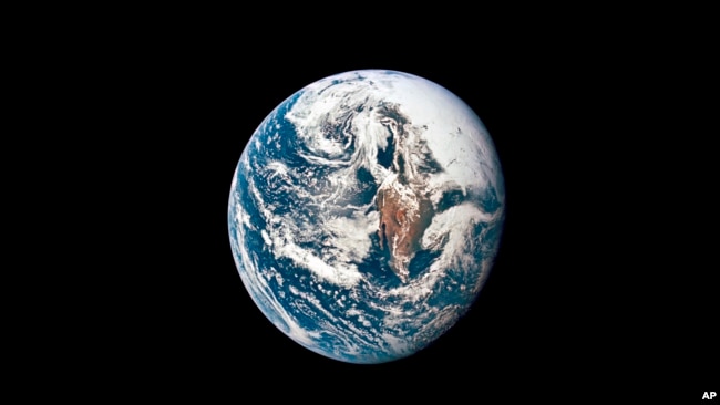 This May 18, 1969 photo made available by NASA shows Earth from 66,672 kilometers away as photographed from the Apollo 10 spacecraft. (NASA via AP)
