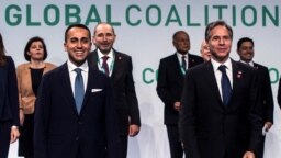 U.S. Secretary of State Antony Blinken, right, and Italian Minister of Foreign Affairs Luigi Di Maio, center, pose for a family photo as they host a meeting of US-led coalition against the Islamic State in Rome on June 28, 2021.