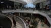 FILE - Shoppers make their way along the wide avenues inside the newly opened Mall of Africa in Midrand, South Africa, April 28, 2016.