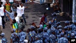 FILE - Ethiopian security forces intervene on Meskel Square in Addis Ababa on June 23, 2018, where a blast killed two people and injured more than 150, during a rally led by Prime Minister Abiy Ahmed.