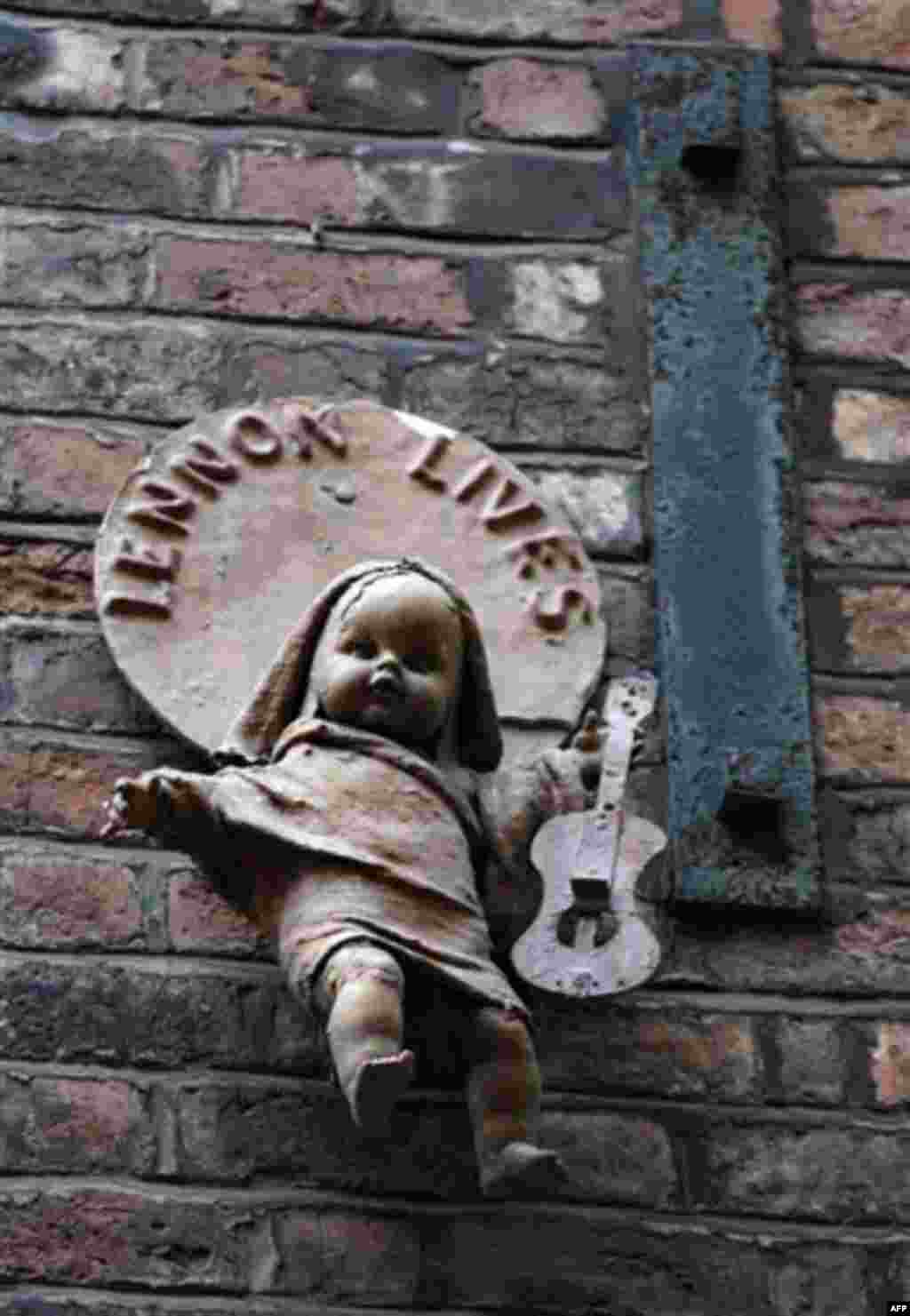 A monument to John Lennon in Mathew Street, Liverpool, England, Wednesday Dec. 8, 2010. Beatles fans will mark the 30th anniversary of John Lennon's death with a candlelit vigil at the city's European Peace Monument, which is dedicated to John Lennon. (AP