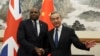 British Foreign Secretary David Lammy, left, and Chinese Foreign Minister Wang Yi shake hands before their meeting at the Diaoyutai State Guesthouse in Beijing on Oct. 18, 2024.