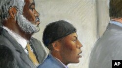 In this courtroom drawing, Umar Farouk Abdulmutallab (C) appears in U.S. District Judge Nancy Edmunds' courtroom in Detroit, Michigan, with Anthony Chambers, the lawyer who was assisting in his defense (L) and Assistant U.S. Attorney Jonathan Tukel (R), O