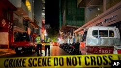 Maldivian police officers secure the area following a blast in Male, Maldives, May 6, 2021. 