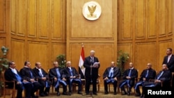 Adly Mansour (C), Egypt's chief justice and head of the Supreme Constitutional Court, speaks at his swearing in ceremony as the nation's interim president in Cairo July 4, 2013. 
