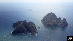 FILE - Islands called Dokdo in Korea and Takeshima in Japan