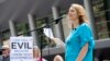 FILE - Rape survivor and abuse victim advocate Mary DeMuth speaks during a rally protesting the Southern Baptist Convention's treatment of women outside the convention's annual meeting at the Kay Bailey Hutchison Convention Center in Dallas. 