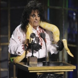 Alice Cooper gives his induction speech with a snake around his neck at the Rock and Roll Hall of Fame ceremony last week in New York