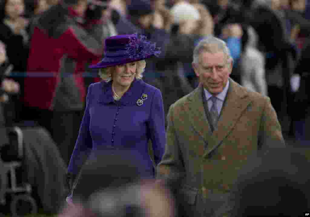 Britain's Prince Charles and his wife Camilla the Duchess of Cornwall arrive for the British royal family's traditional Christmas Day church service in Sandringham, England, December 25, 2012. 