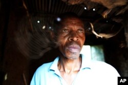 FILE—Patrick Hakizimana, a Hutu peasant who was jailed from 1996 to 2007 for his alleged role in the genocide as an army corporal, stands at his house in Gahanga the outskirts of Kigali, Rwanda Tuesday, April 4, 2024.