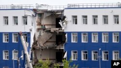 A military barrack with collapsed ceiling is seen at a base in Omsk, Russia, July 13, 2015.