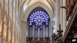 View of the stained glass rose window and the great organs as French President Emmanuel Macron visits the restored interiors of the Notre-Dame de Paris cathedral, Nov. 29, 2024 in Paris.