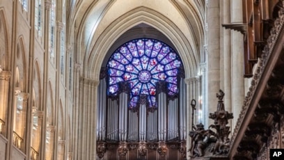 View of the stained glass rose window and the great organs as French President Emmanuel Macron visits the restored interiors of the Notre-Dame de Paris cathedral, Nov. 29, 2024 in Paris.