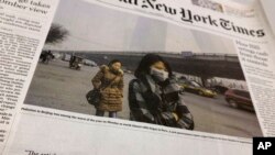 FILE - Front page of an Asian edition of the International New York Times has a blank space where the printer omitted sensitive content, Bangkok, Thailand, Dec. 1, 2015.