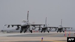 FILE - US Air force F-16 jet fighters taxi for take off during the "Max Thunder" South Korea-US military joint air exercise at a US air base in the southwestern port city of Gunsan on April 20, 2017.