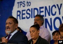 Los Angeles City Council member Gil Cedillo, far left, speaks following an announcement on the fate of Temporary Protected Status for nationals of El Salvador, in Los Angeles, Jan. 8, 2018.