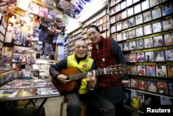 Kazuhiko Kobayashi, 80, and his wife, Mieko Kobayashi, 73, at their music shop named Ameyoko Rhythm, specialized for Enka, traditional Japanese popular ballad, in Tokyo's Ameyoko shopping district, Japan, Feb. 8, 2018.