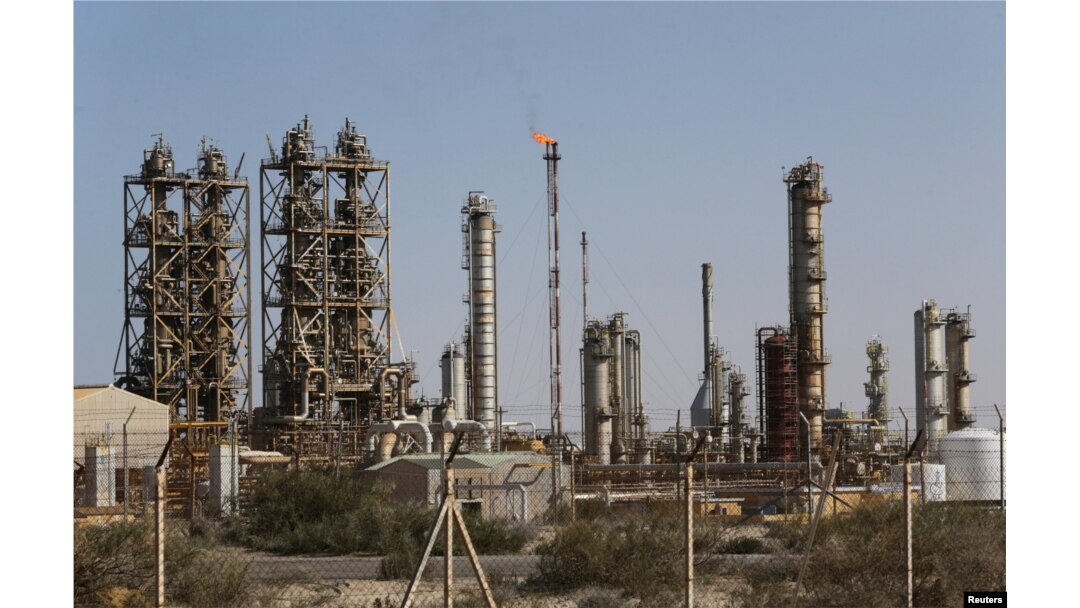 FILE — Pipelines are seen at the industrial zone at the oil port of Brega, Libya, Jan. 12, 2017.
