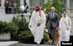Saudi Arabia's Deputy Crown Prince and Minister of Defense Mohammed Bin Salman (L) arrives at the Oval Office of the White House for a meeting with U.S. President Barack Obama in Washington, June 17, 2016
