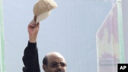 Meles Zenawi gestures to Ethiopians gathering at Meskel Square in Addis Ababa, Ethiopia, Saturday, May 28, 2011