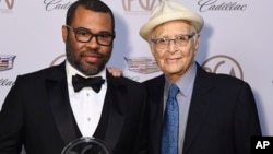 Jordan Peele, recipient of the Stanley Kramer award, left, and Norman Lear attend the 29th Producers Guild Awards at Beverly Hilton, Jan. 20, 2018, in Beverly Hills, Calif.