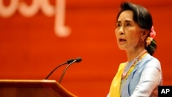 FILE - Myanmar's State Counsellor Aung San Suu Kyi speaks during the opening ceremony of the second session of the 21st Century Panglong Union Peace Conference at the Myanmar International Convention Centre in Naypyitaw, Myanmar.