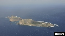 Handout photograph shows the disputed islets, known as Senkaku in Japan and Diaoyu in China, Dec. 13, 2012.