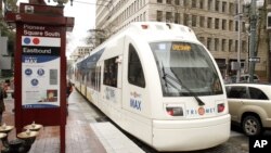 A Tri-Met light rail train rolls through downtown Portland, Ore., April 11, 2012. Two people were stabbed to death and a third person was injured when they tried to stop a man from shouting racial slurs at two women who appeared to be Muslim.