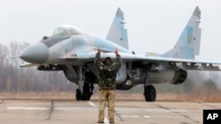 A Ukrainian MIG-29 fighter jet is parked at the Vasilkov air base outside outside Kyiv, Ukraine, Nov. 23, 2016. A Polish version of the MIG-29 crashed Monday in central Poland. 