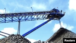 A conveyor belt carries ore extracted at Mimosa Platinum mine about 400km (249 miles) south of the capital Harare, Zimbabwe, Feb. 16, 2012.