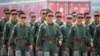 Members of Chinese People's Liberation Army (PLA) Air Force Red Falcon aerobatic team attend the China International Aviation and Aerospace Exhibition in Guangdong province, China, Sept. 28, 2021. 