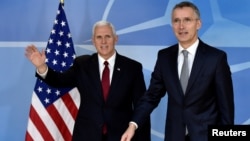 NATO Secretary-General Jens Stoltenberg welcomes U.S. Vice President Mike Pence at the NATO headquarters in Brussels, Belgium, Feb. 20, 2017.