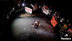 Jennelyn Olaires, 26, weeps over the body of her partner, who was killed on a street by a vigilante group, according to police, in a spate of drug related killings in Pasay city, Metro Manila, Philippines, July 23, 2016.