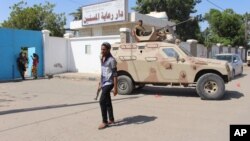 Yemeni security forces gather outside an elderly care home after it was attacked by gunmen in the port city of Aden, Yemen, March 4, 2016. 