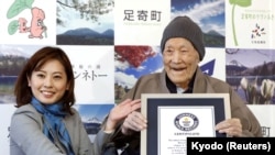 Japanese Masazo Nonaka, who was born 112 years and 259 days ago, receives a Guinness World Records certificate naming him the world's oldest man during a ceremony in Ashoro, on Japan's northern island of Hokkaido, April 10, 2018.