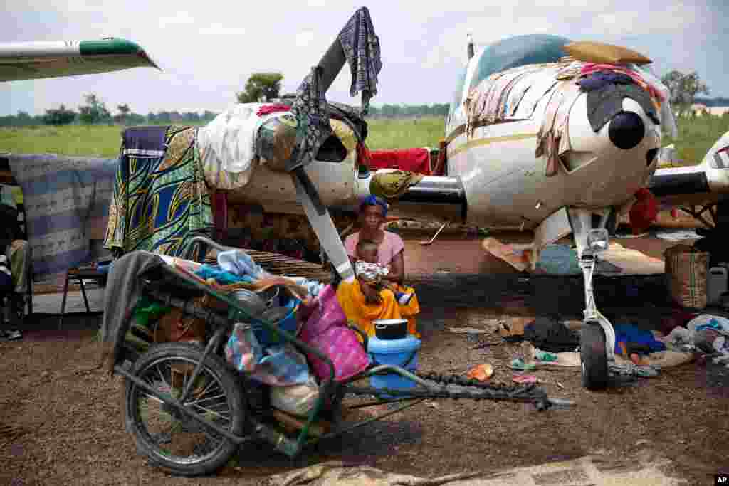 Christians gather in a makeshift camp for internally displaced people set in the airport in Bangui, Central African Republic. Over 30,000 have gathered there after days of sectarian violence, prompting the U.N. to start food distribution a kilometer away.