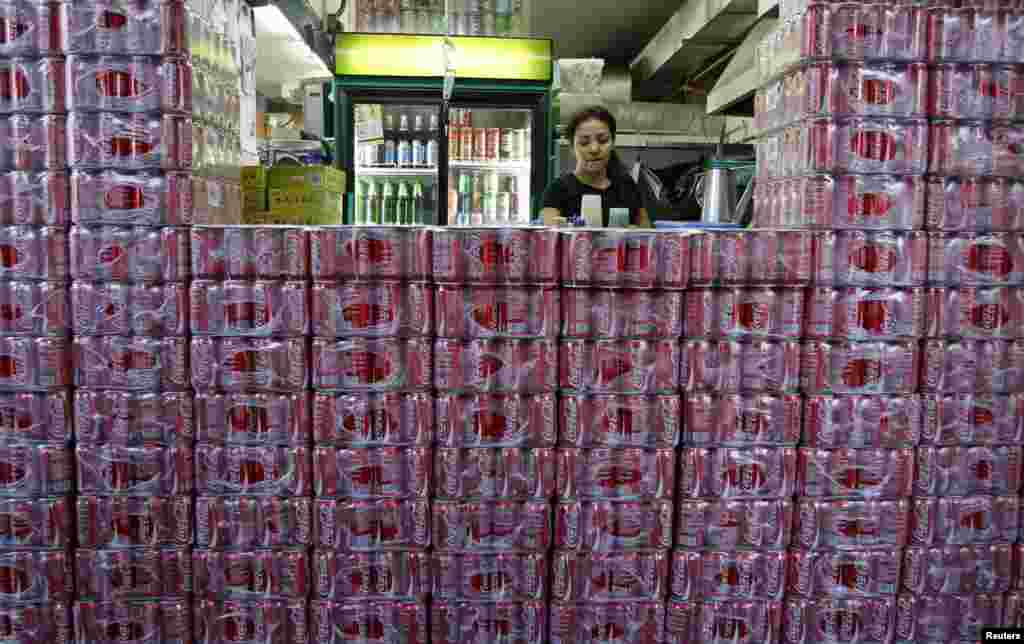 Crates of Coca-Cola are seen stacked outside a counter of a coffee shop in Singapore.