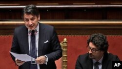 Italian Premier Giuseppe Conte, flanked by Infrastructures and Transport Minister Toninelli, addresses the Italian Senate, March 19, 2019. Conte has pledged to make Italy the first G7 nation to join China's ambitious Belt and Road Initiative.