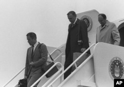President Nixon's White House Chief of Staff H.R. Haldeman, left, and presidential adviser John D. Ehrlichman, right, deplane Air Force One at Andrews Air Force Base in Md. in this April 1973 file photo.