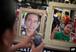 Seorang pendukung Jokowi dalam kampanye pilpres 2014, 22 Juni 2014. (Foto:dok)