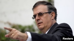 FILE - Marcelo Ebrard, picked by Mexico's President-Elect Andres Manuel Lopez Obrador as an Foreign Minister, gestures during a news conference in Mexico City, Oct. 1, 2018. 
