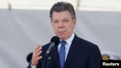 Colombian President Juan Manuel Santos gives a speech during a ceremony to mark the 94th anniversary of the Colombian Air Force at a military base in Bogota, Nov. 8, 2013
