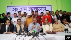Bangladesh's opposition leader Kamal Hossain addresses a press conference after his motorcade was allegedly attacked in Dhaka, Bangladesh, Dec. 14, 2018.