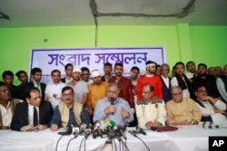 Bangladesh's opposition leader Kamal Hossain addresses a press conference after his motorcade was allegedly attacked in Dhaka, Bangladesh, Dec. 14, 2018.