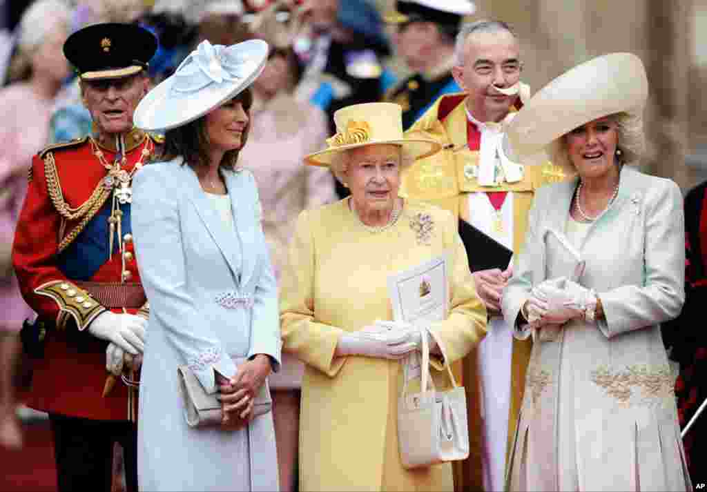 From left, Prince Phillip, Carole Middleton, Britain's Queen Elizabeth II and Camilla, Duchess of Cornwall stand outside of Westminster Abbey. (AP Photo)