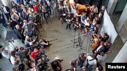 Members of the media gather at the parliamentary inquiry investigating the NSA's activities in Germany, in Berlin, May 7, 2015. 