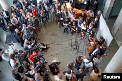 Members of the media gather at the parliamentary inquiry investigating the NSA's activities in Germany, in Berlin, May 7, 2015.